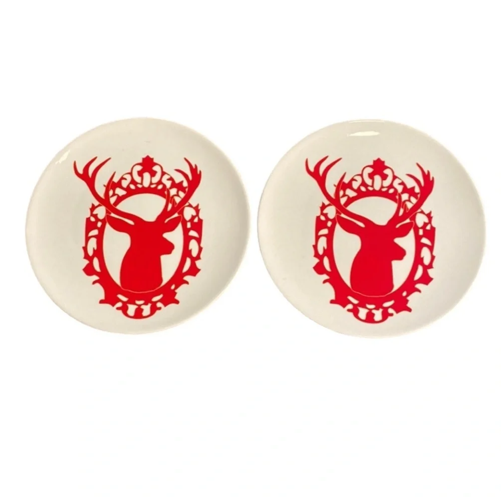 World Market Holiday plates. Set of 2. Red reindeer on a cream color plate.
